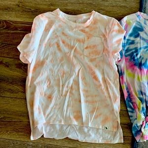Multiple Girls T-Shirts in various colors of pink,yellow and blue.